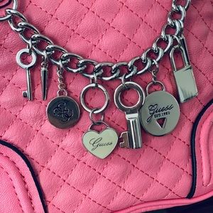 pink guess purse with charms